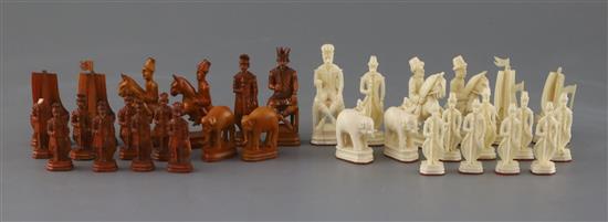 A rare 18th century white and brown walrus ivory Russian chess set, featuring Russians against Persians, in mahogany box,